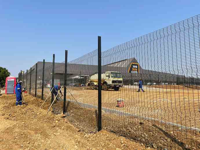 medium density clear view fence powder coated black with electrical fence to top at we buy cars medium density clear view fence powder coated black with electrical fence to top at we buy cars