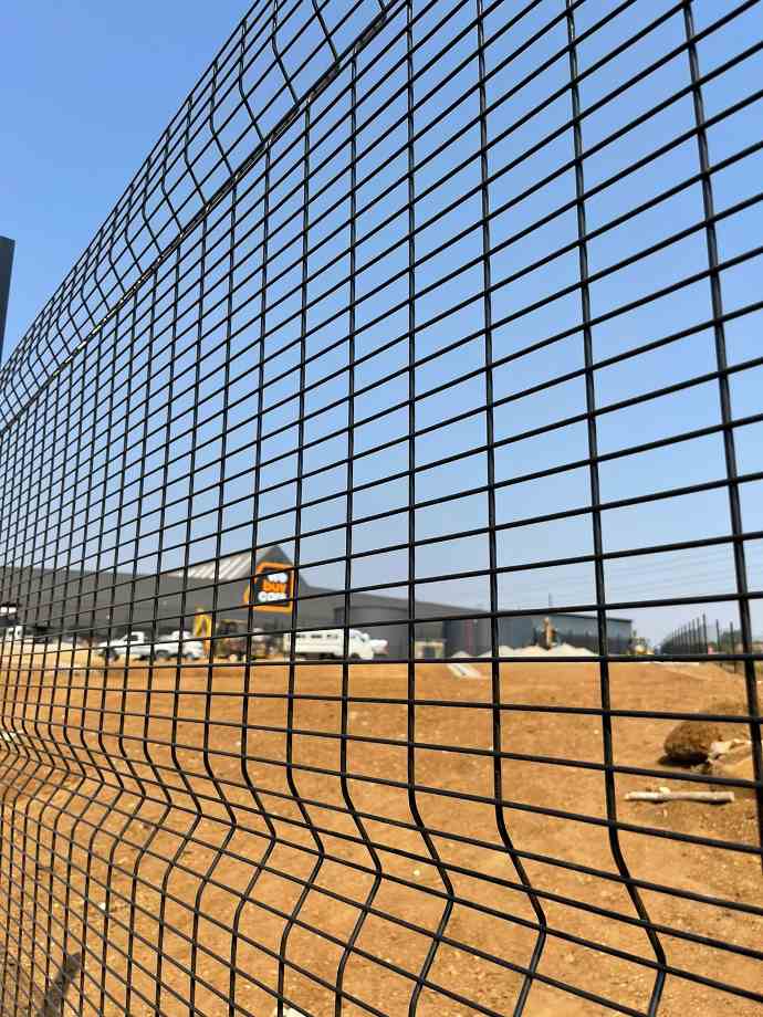 medium density clear view fence powder coated black with electrical fence to top at we buy cars medium density clear view fence powder coated black with electrical fence to top at we buy cars
