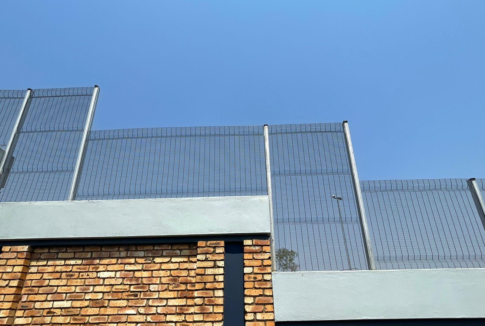 high density clear view fencing galvanized on top of wall
